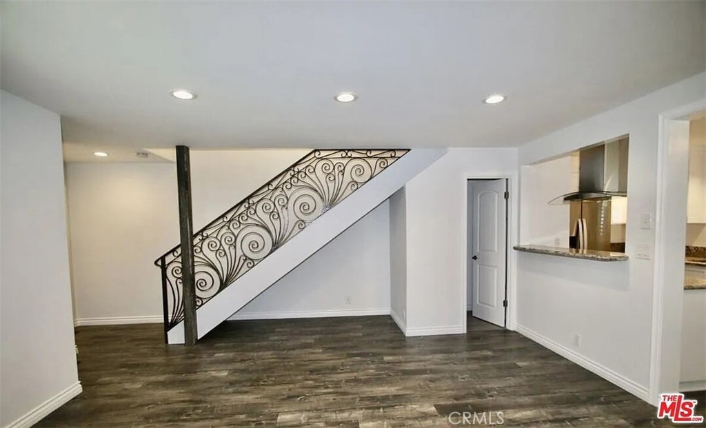 a view of an entryway with wooden floor