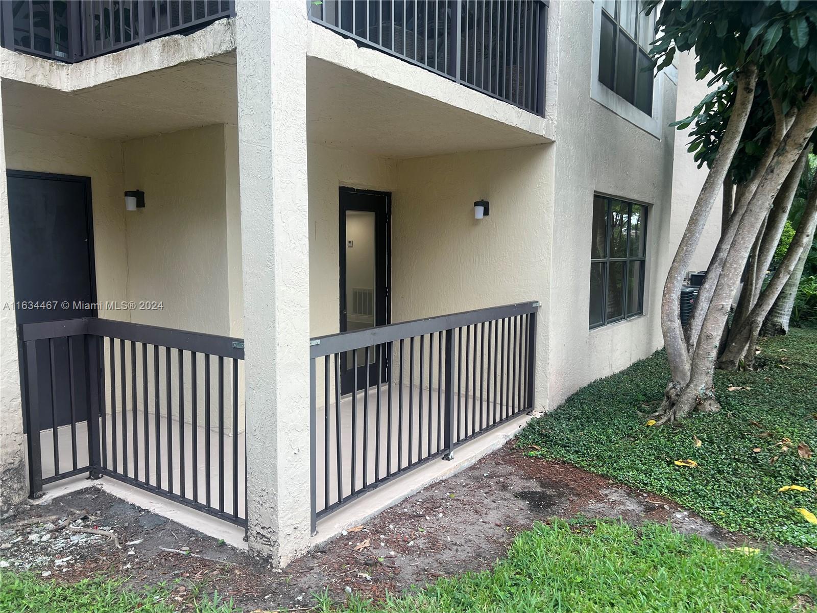 a view of a porch with a small yard