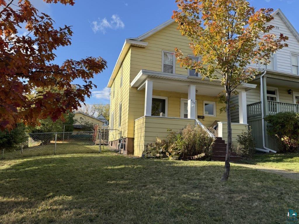 View of front of house with a front yard