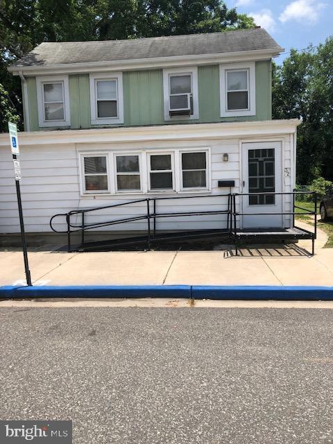 a view of front of house with a yard