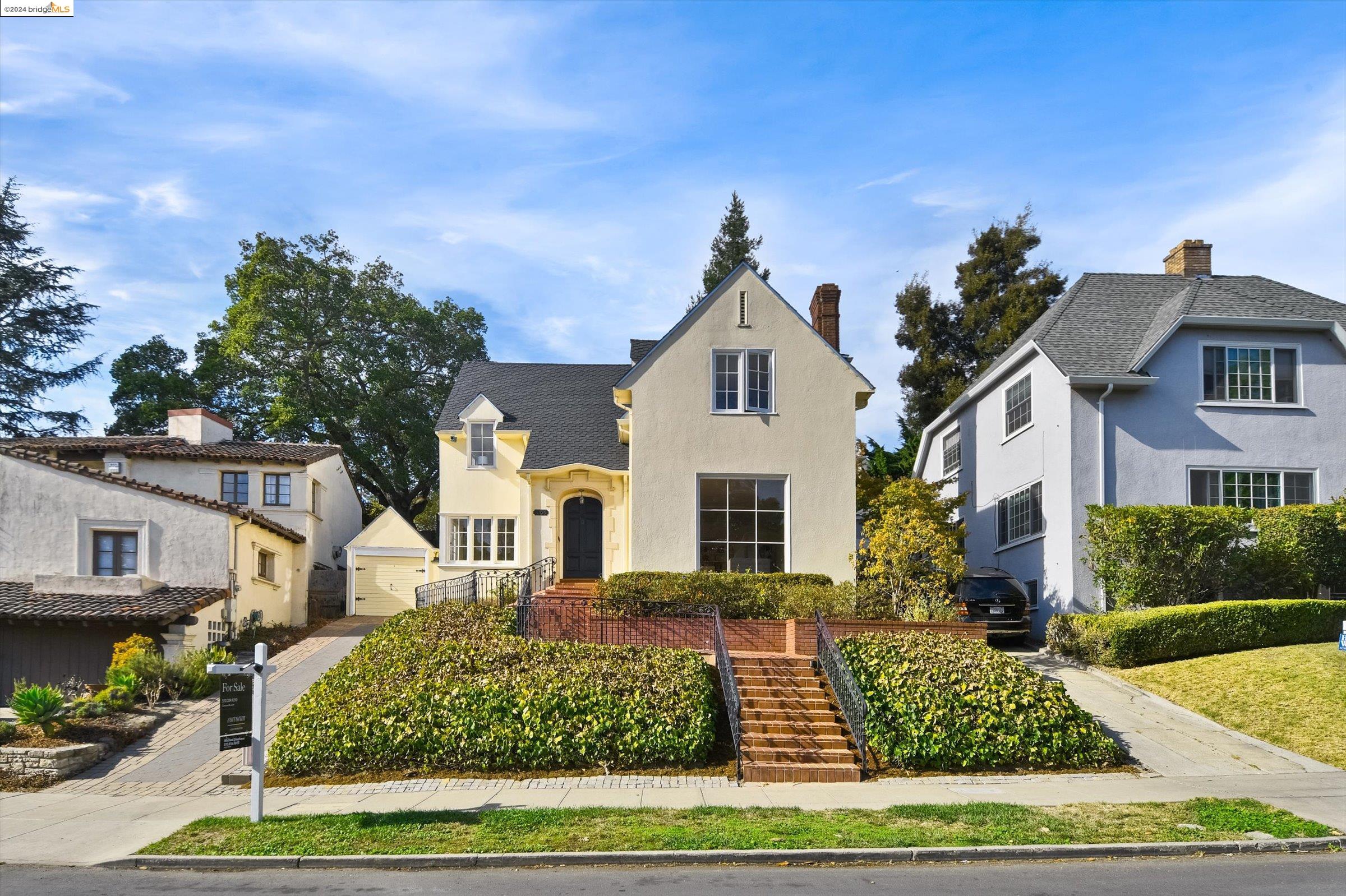 a front view of a house with garden