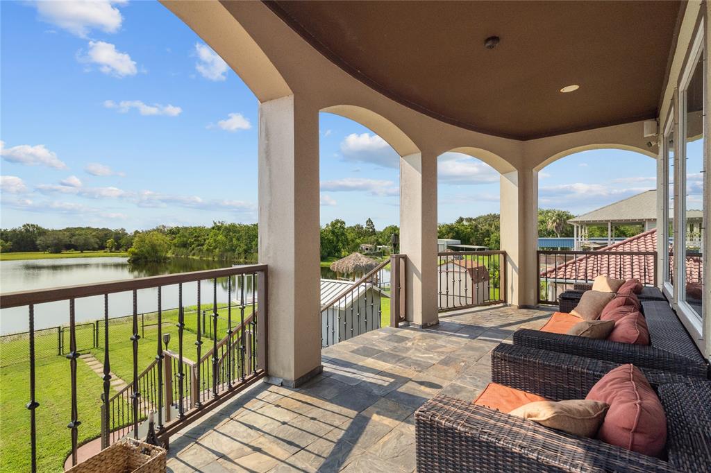 a balcony with furniture and city view