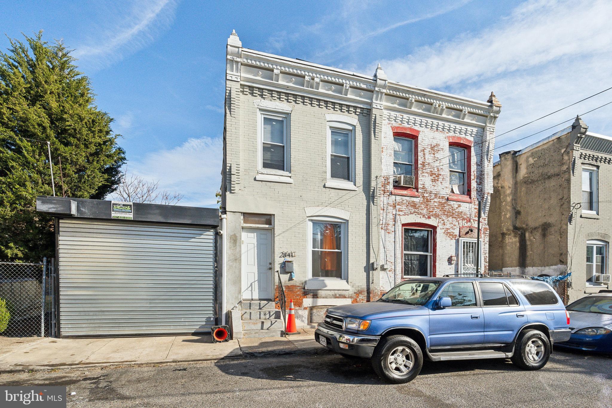 a view of a car parked in front of a house