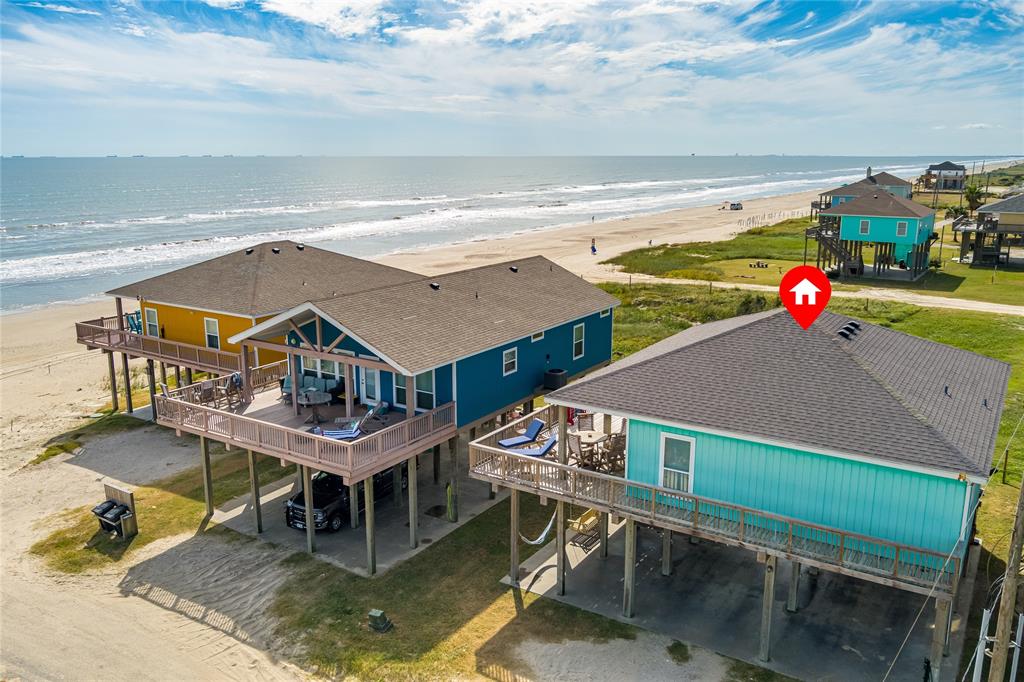 aerial view of a house with swimming pool outdoor seating