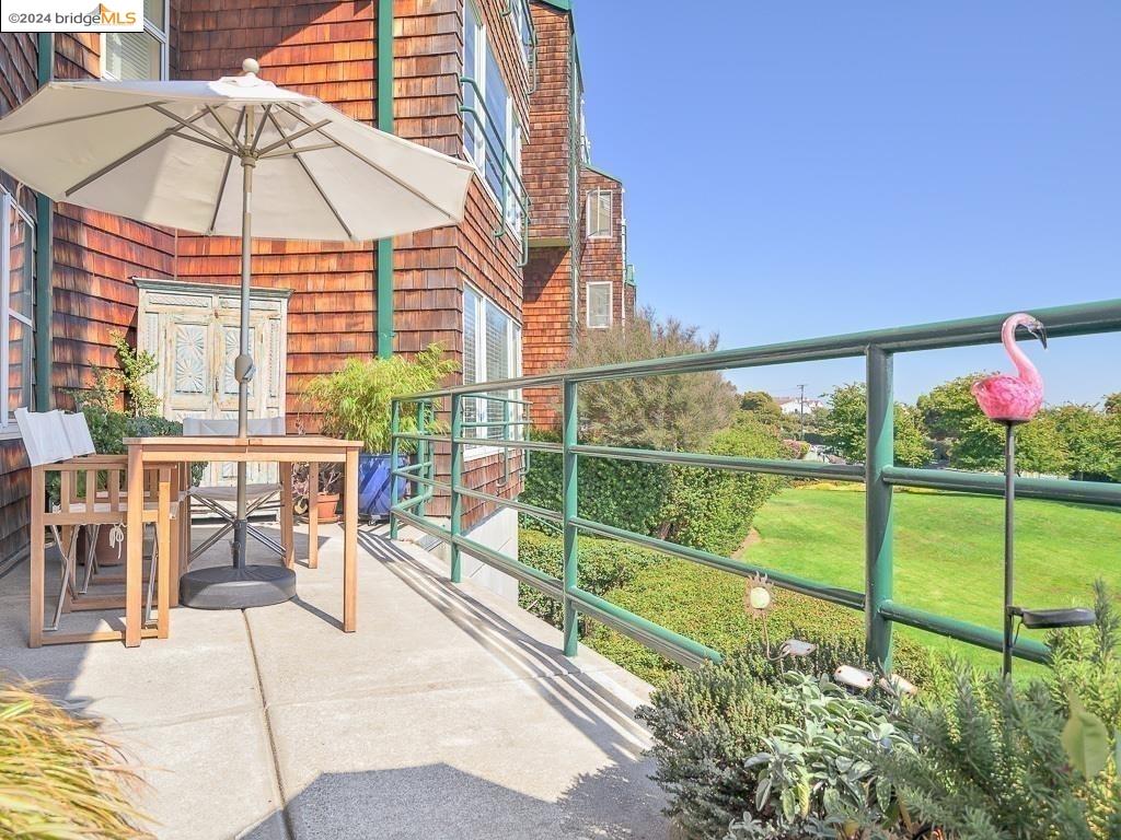 a view of a two chairs and table in the patio