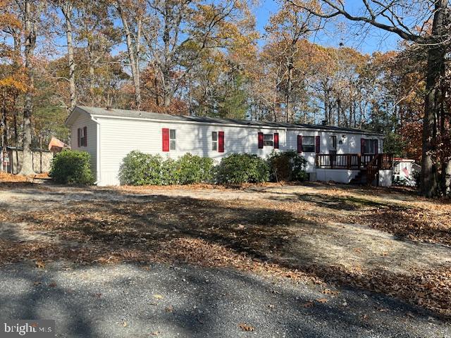 a front view of a house with a yard and a garage