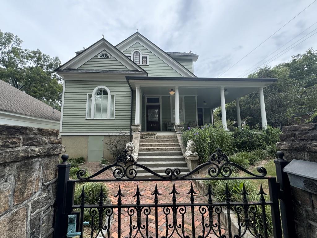 a front view of a house with garden