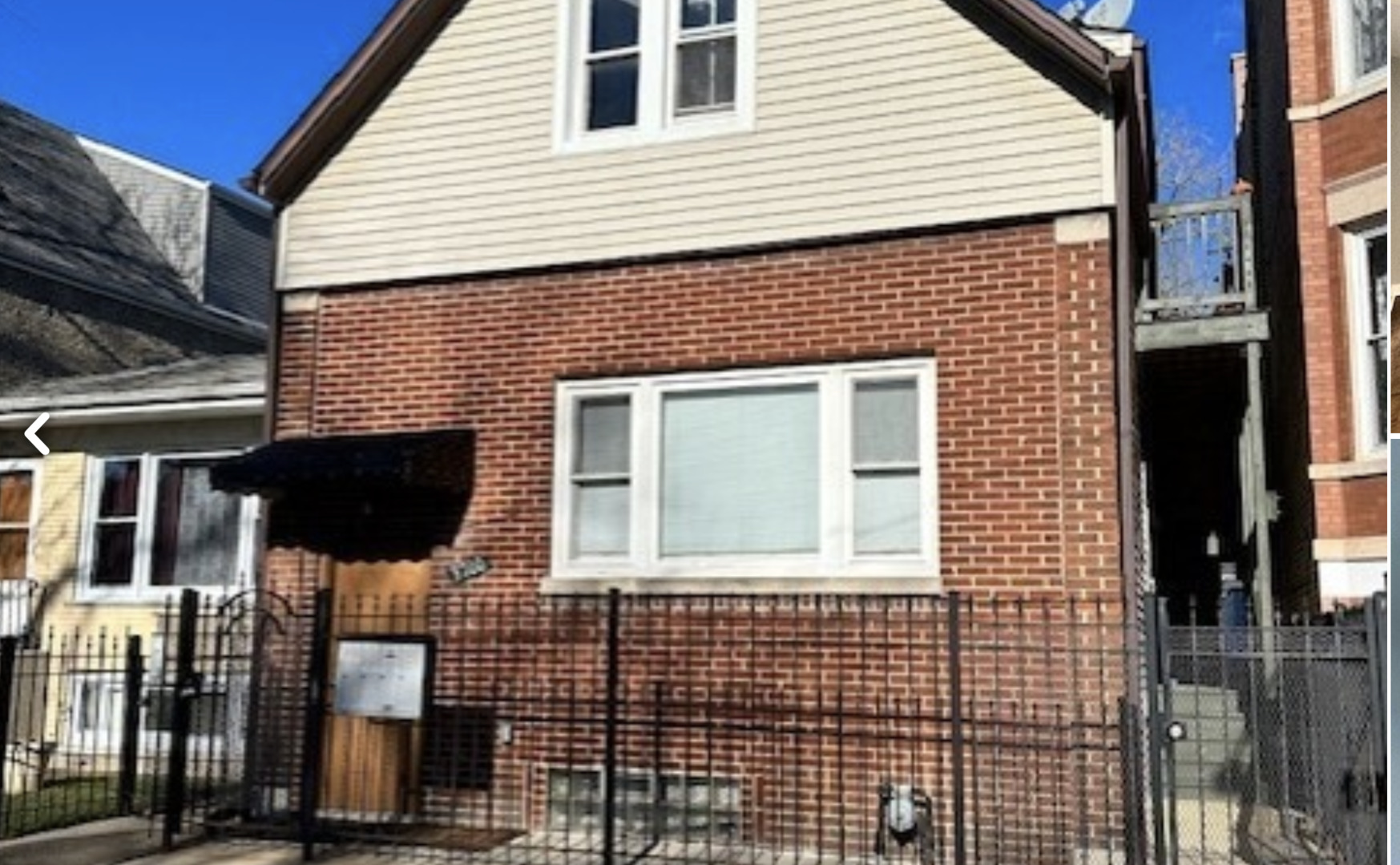 a view of a brick house with a window