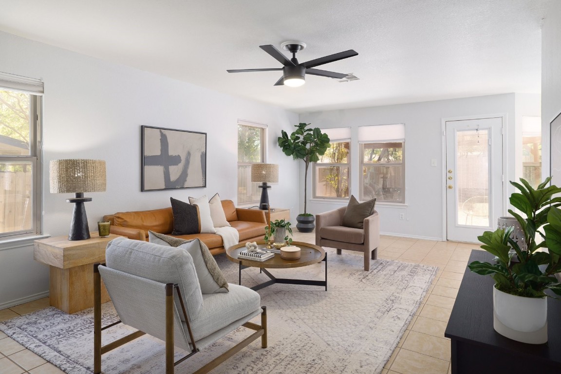 a living room with furniture and a large window