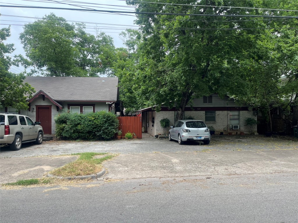 Main house to left. 5 small units to the right of main house