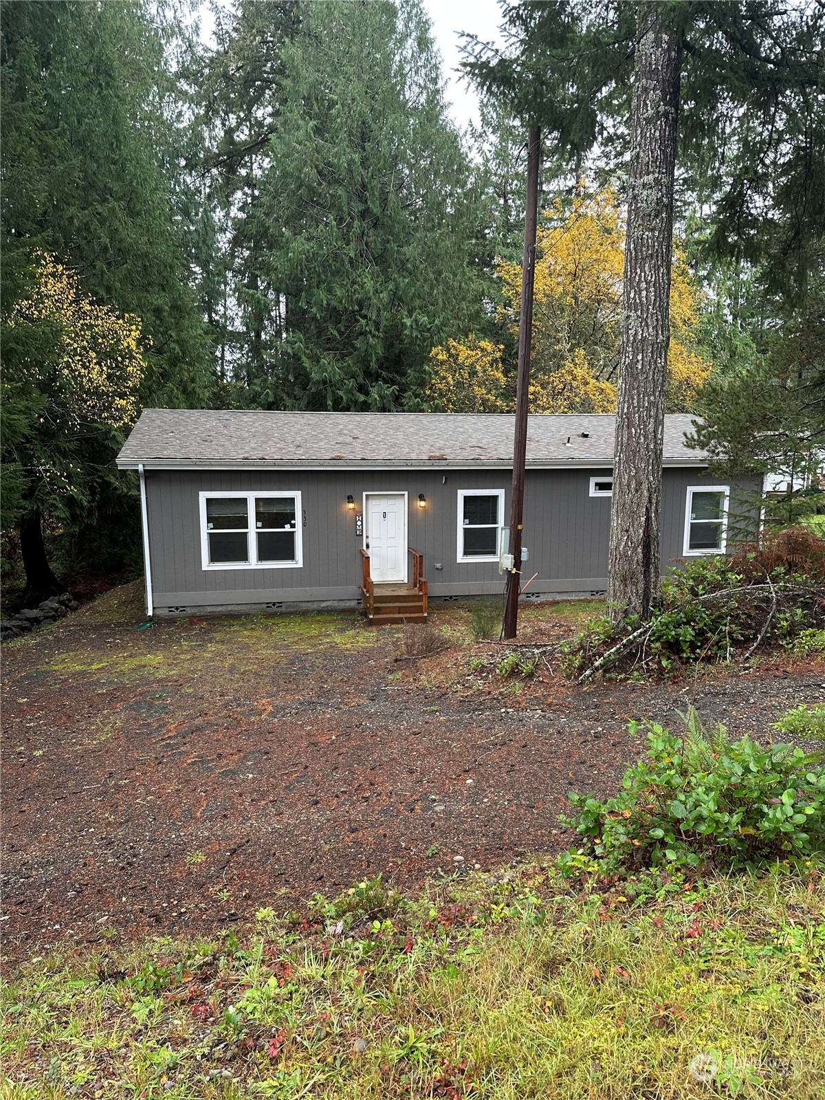 front view of a house with a yard