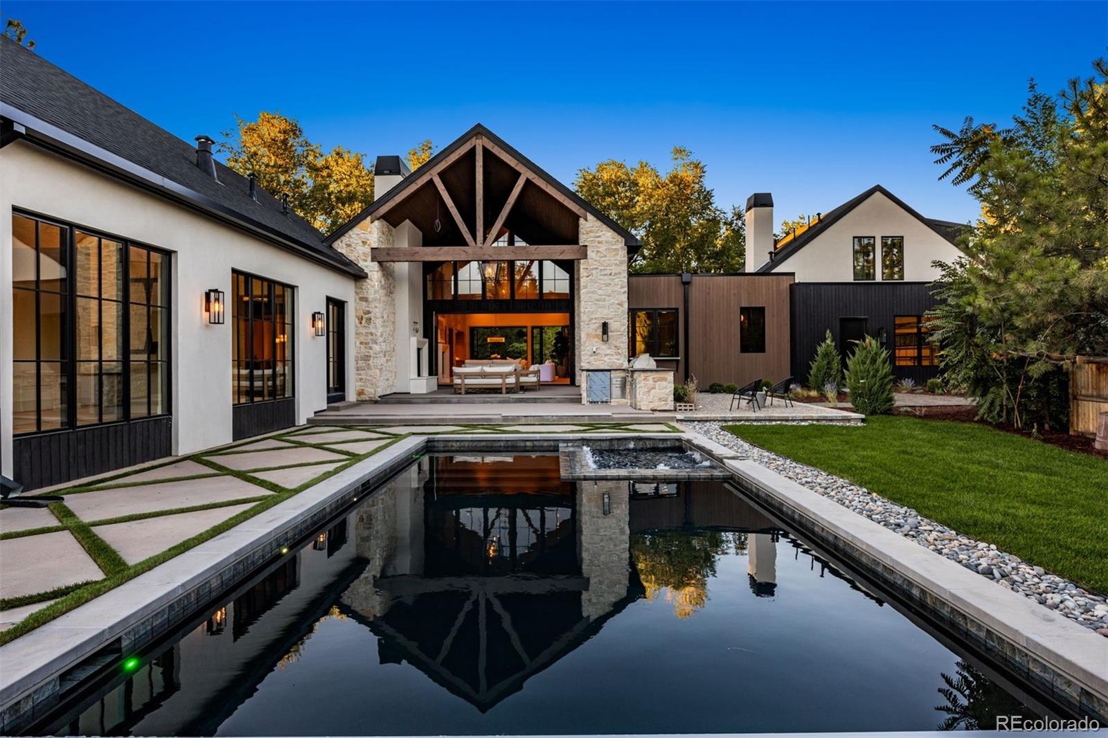 a front view of house with yard and outdoor seating