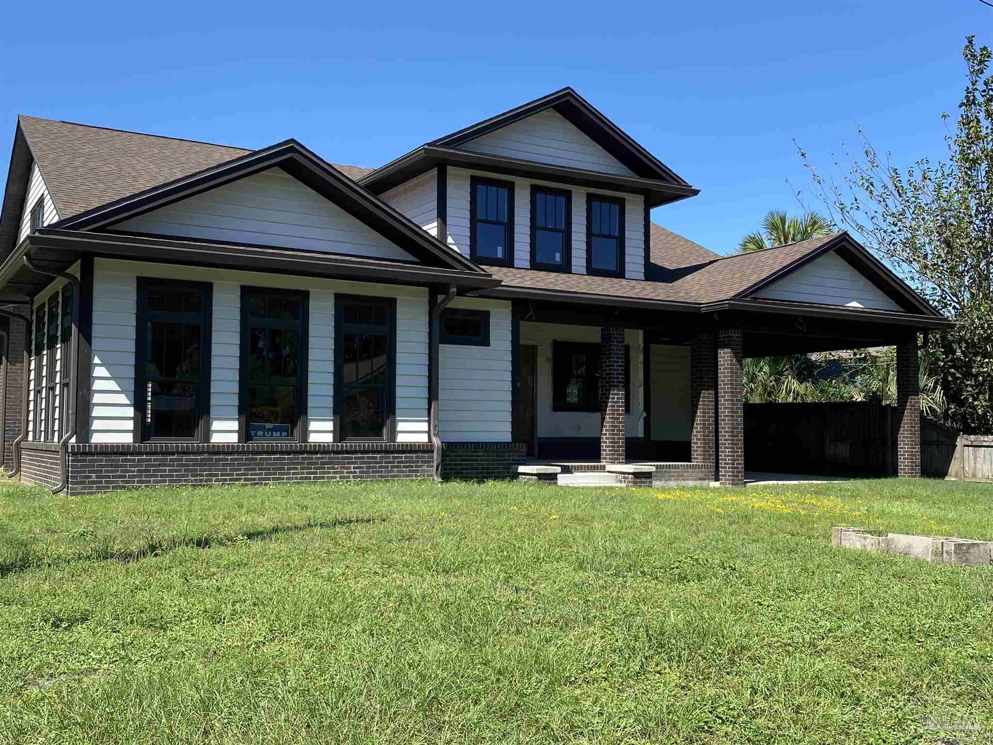 front view of a house with a yard