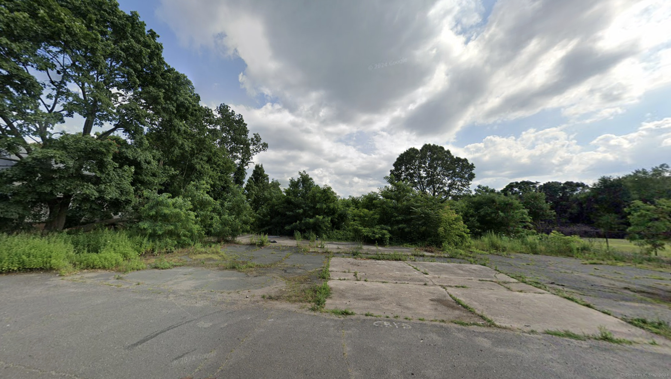 a view of a road with a yard