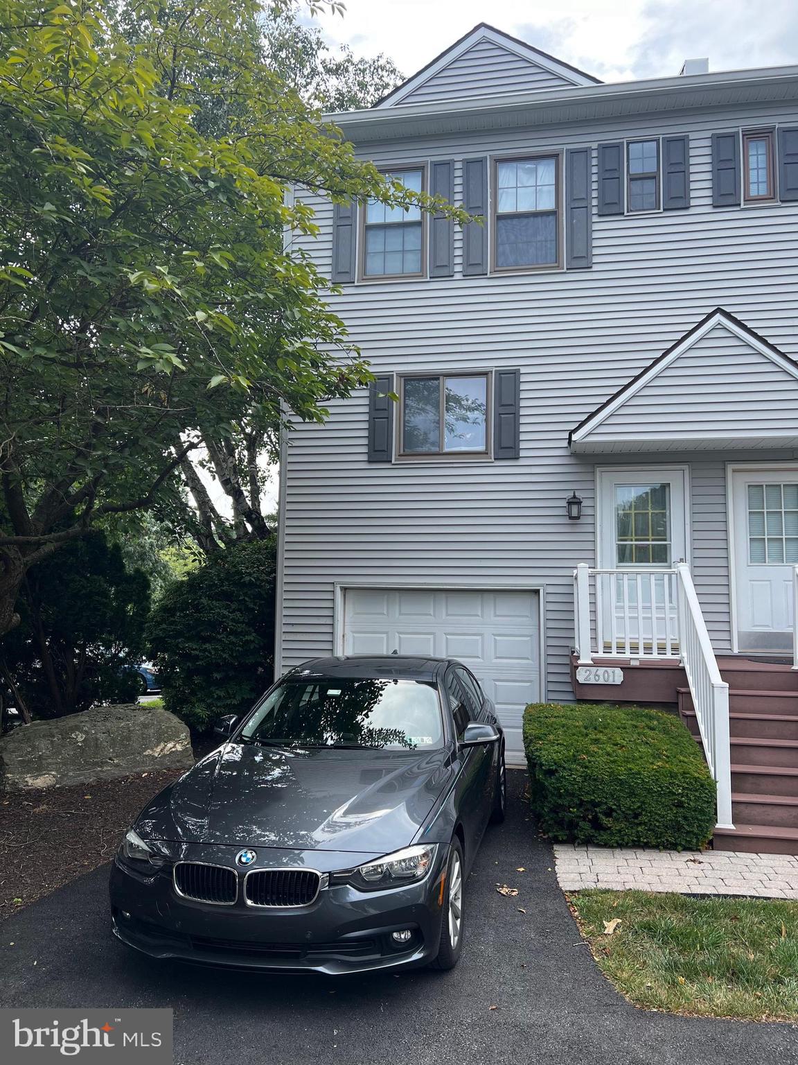 a car parked in front of a house