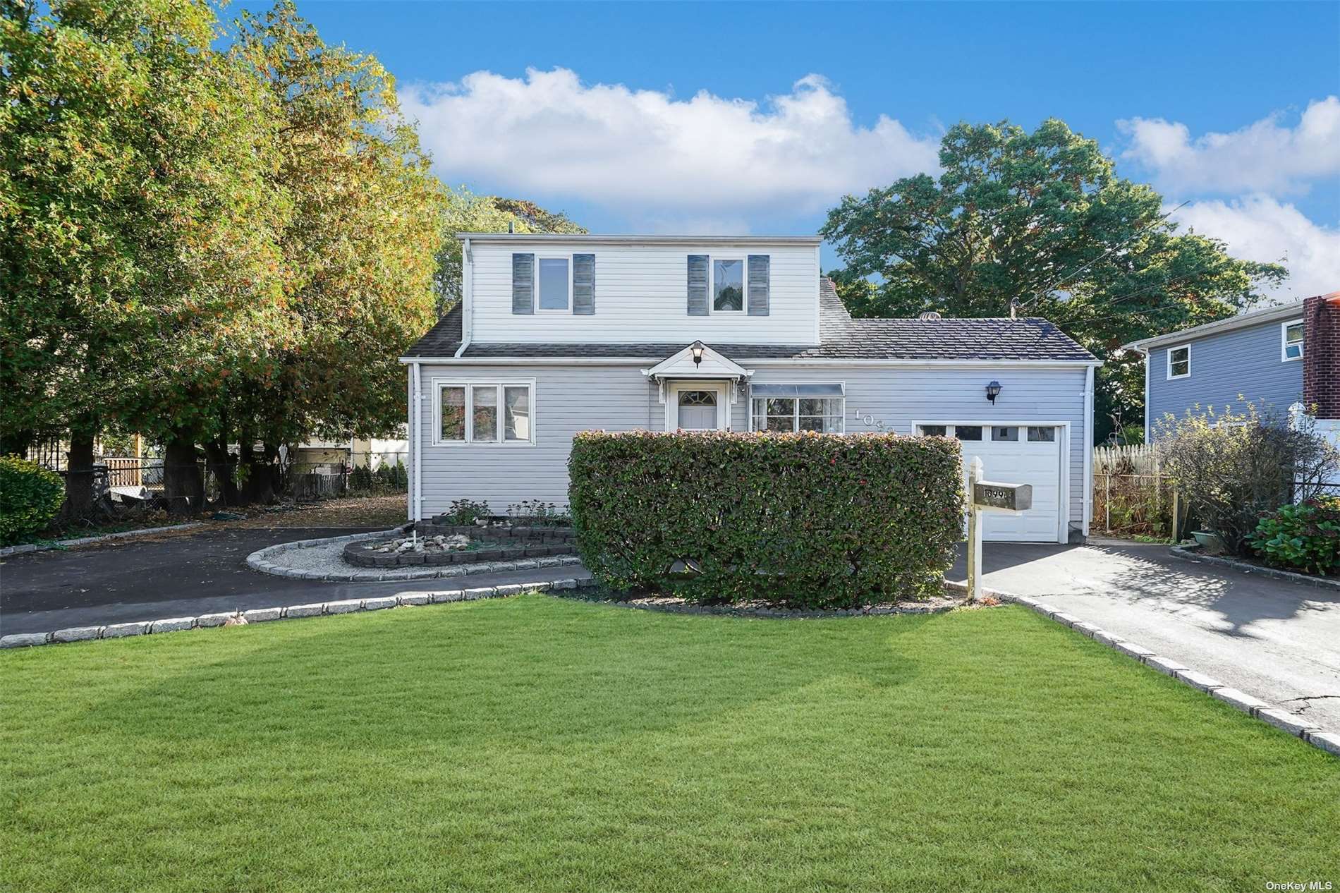 a view of a house with a yard and plants