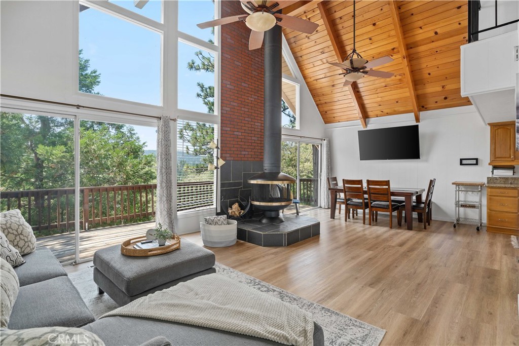 a living room with furniture and large windows