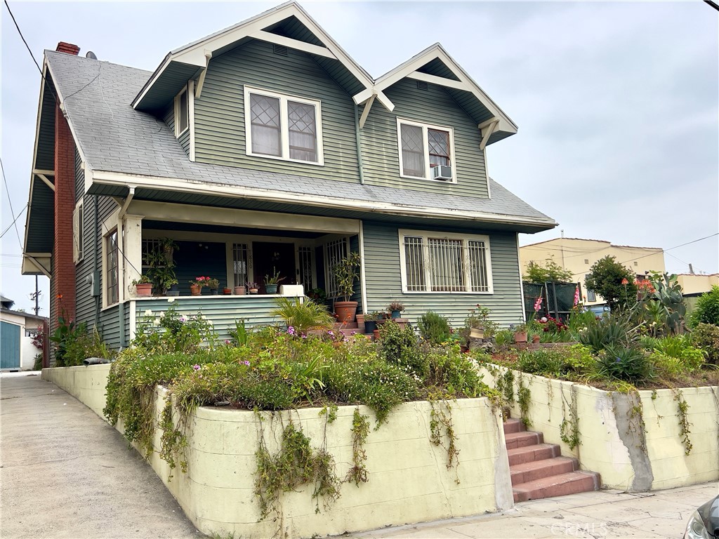 a view of a house with a yard balcony