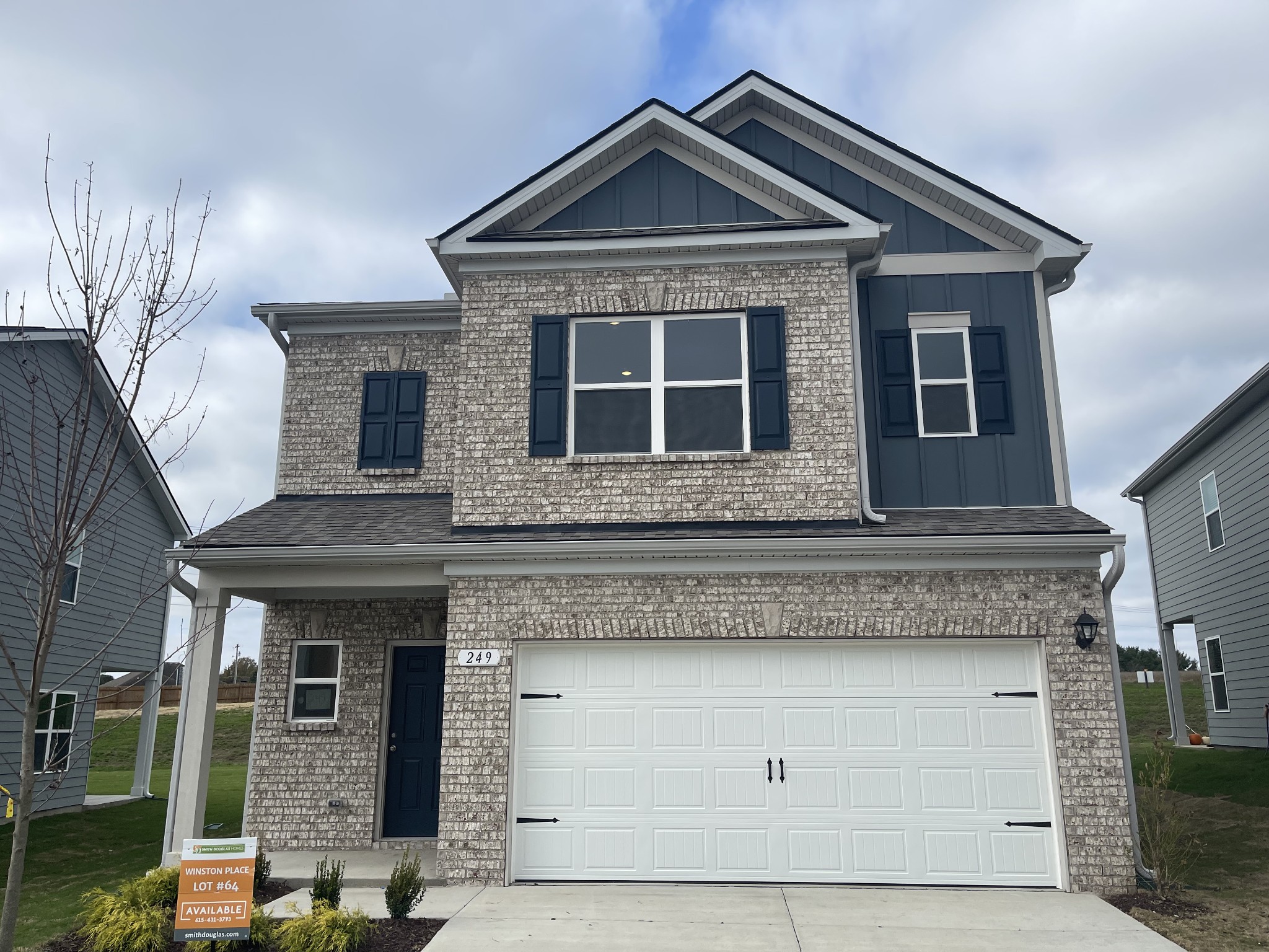 a front view of a house with garage