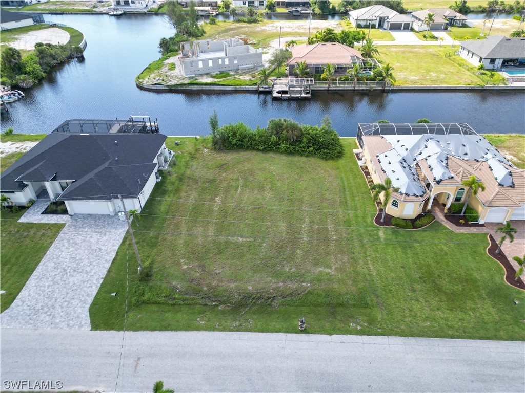 an aerial view of a house with outdoor space