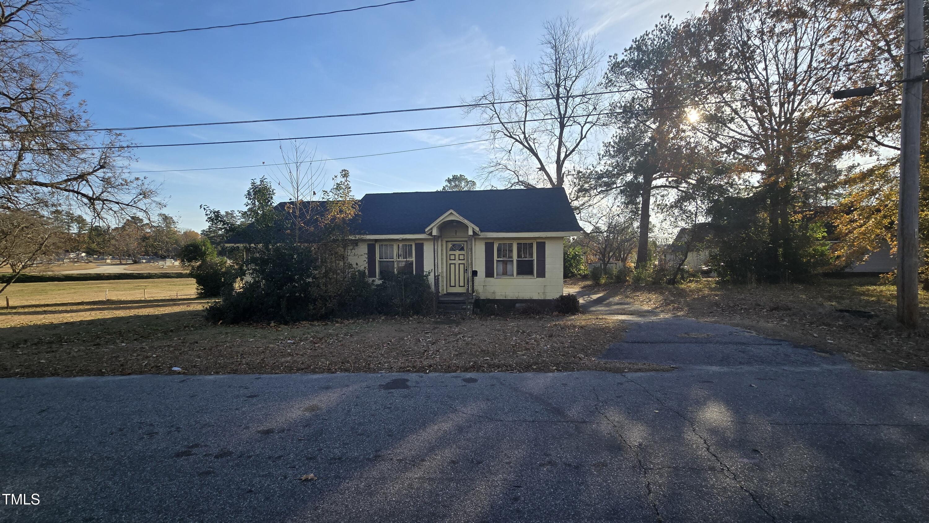 a view of house with outdoor space and street view