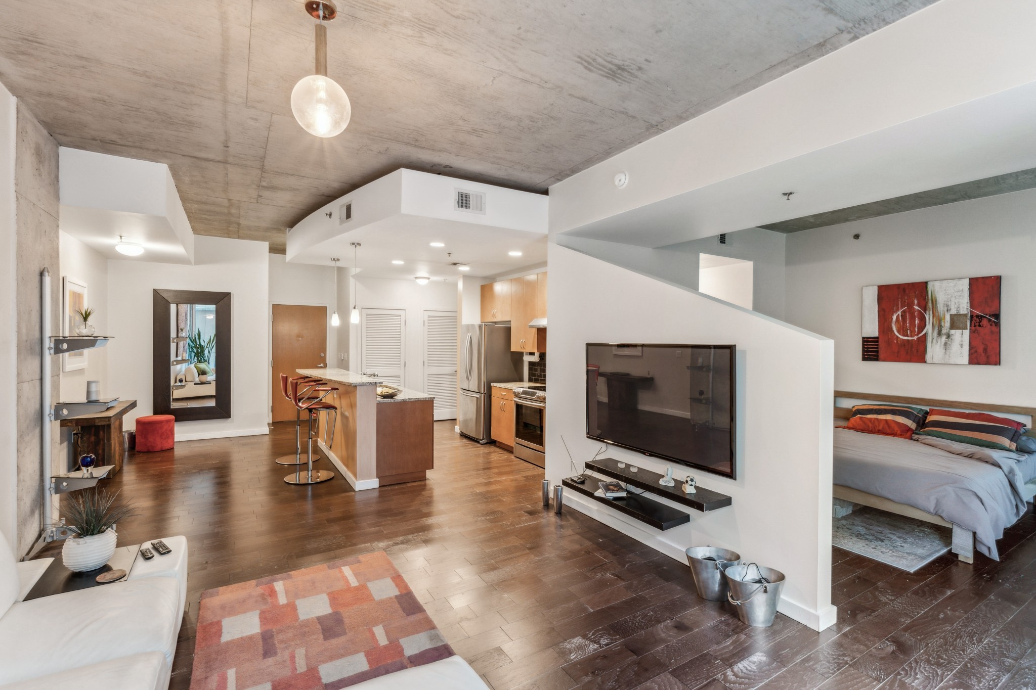 a living room with furniture and a flat screen tv