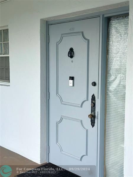 a bathroom with a glass shower door