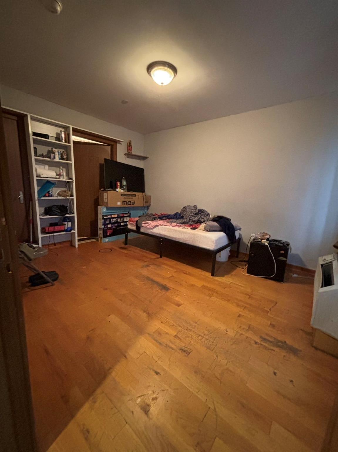 Bedroom featuring hardwood / wood-style floors