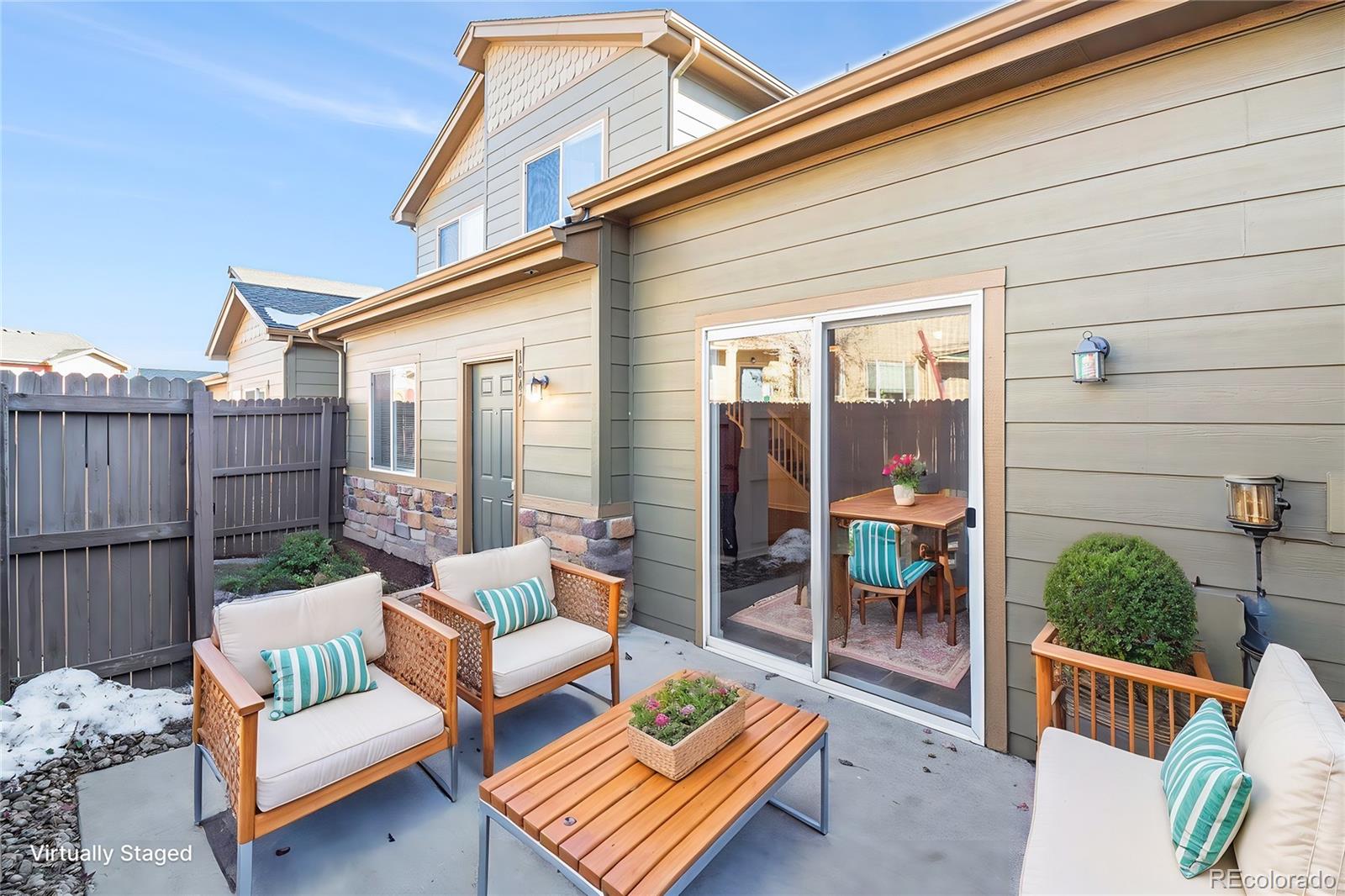 a outdoor living space with patio furniture and a potted plant