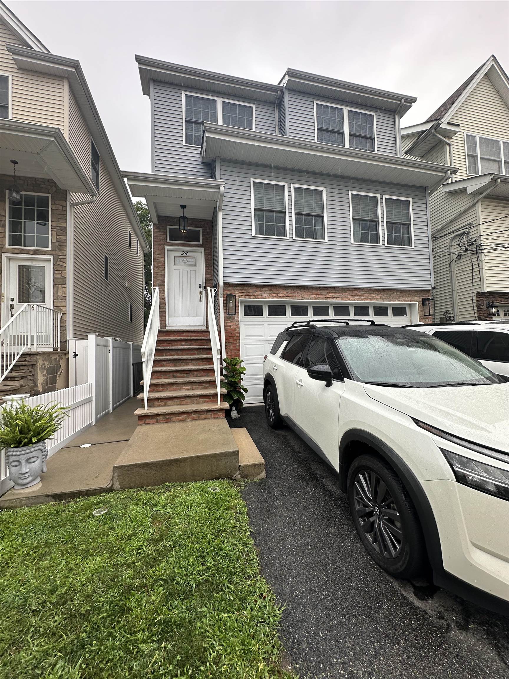 a front view of a house with a yard