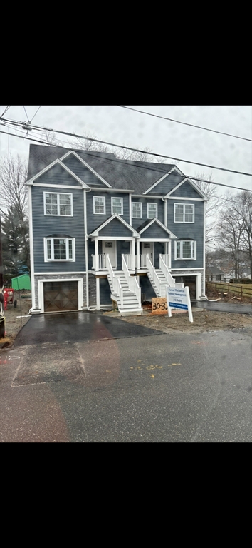 a view of a big house with a street