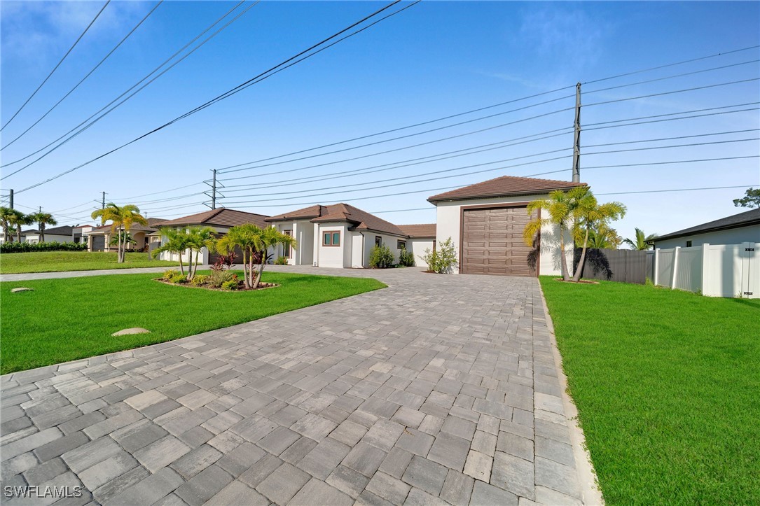 a view of a house with a yard