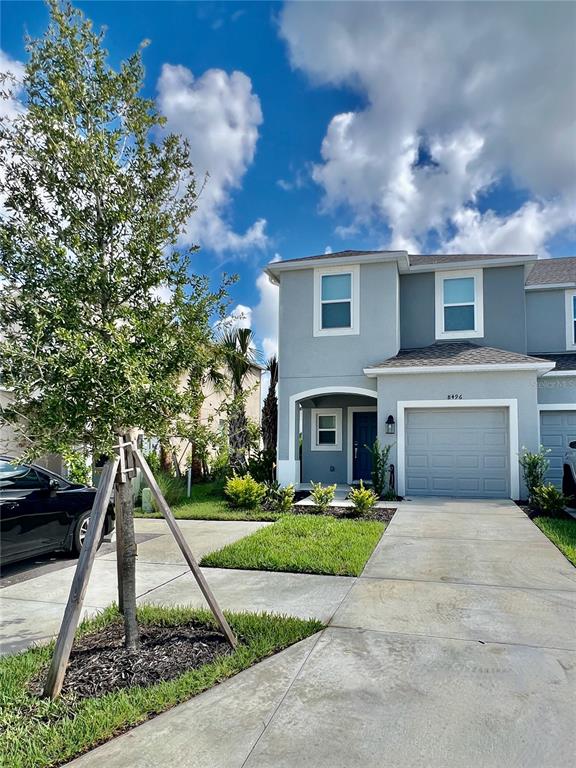 a view of house with yard and entertaining space