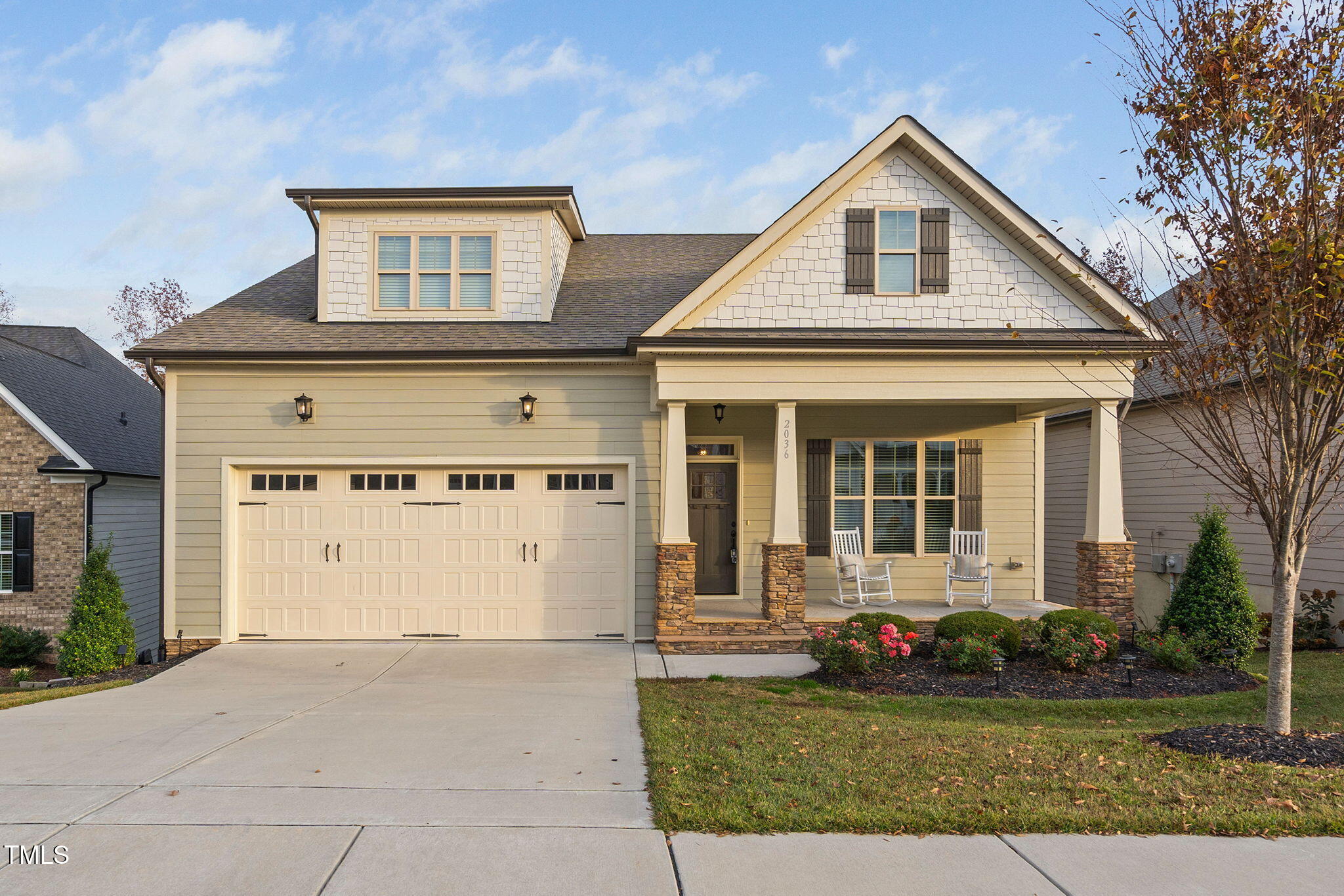 front view of a house with a yard