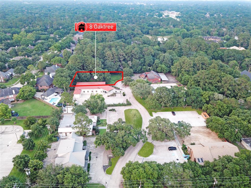 an aerial view of residential house with an outdoor space and street view