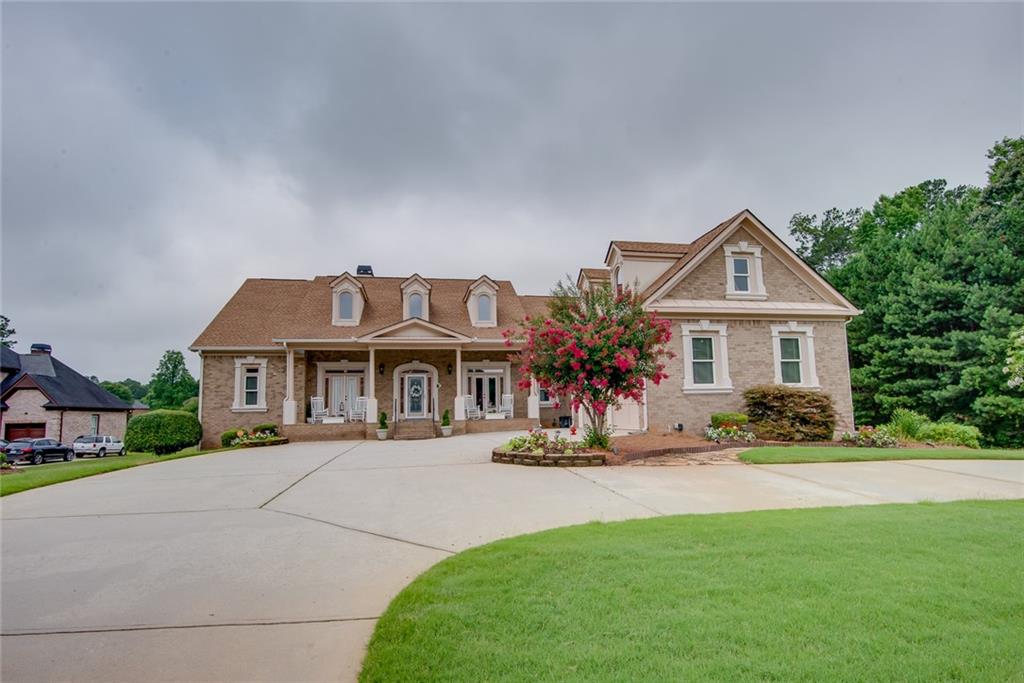 a front view of a house with a yard