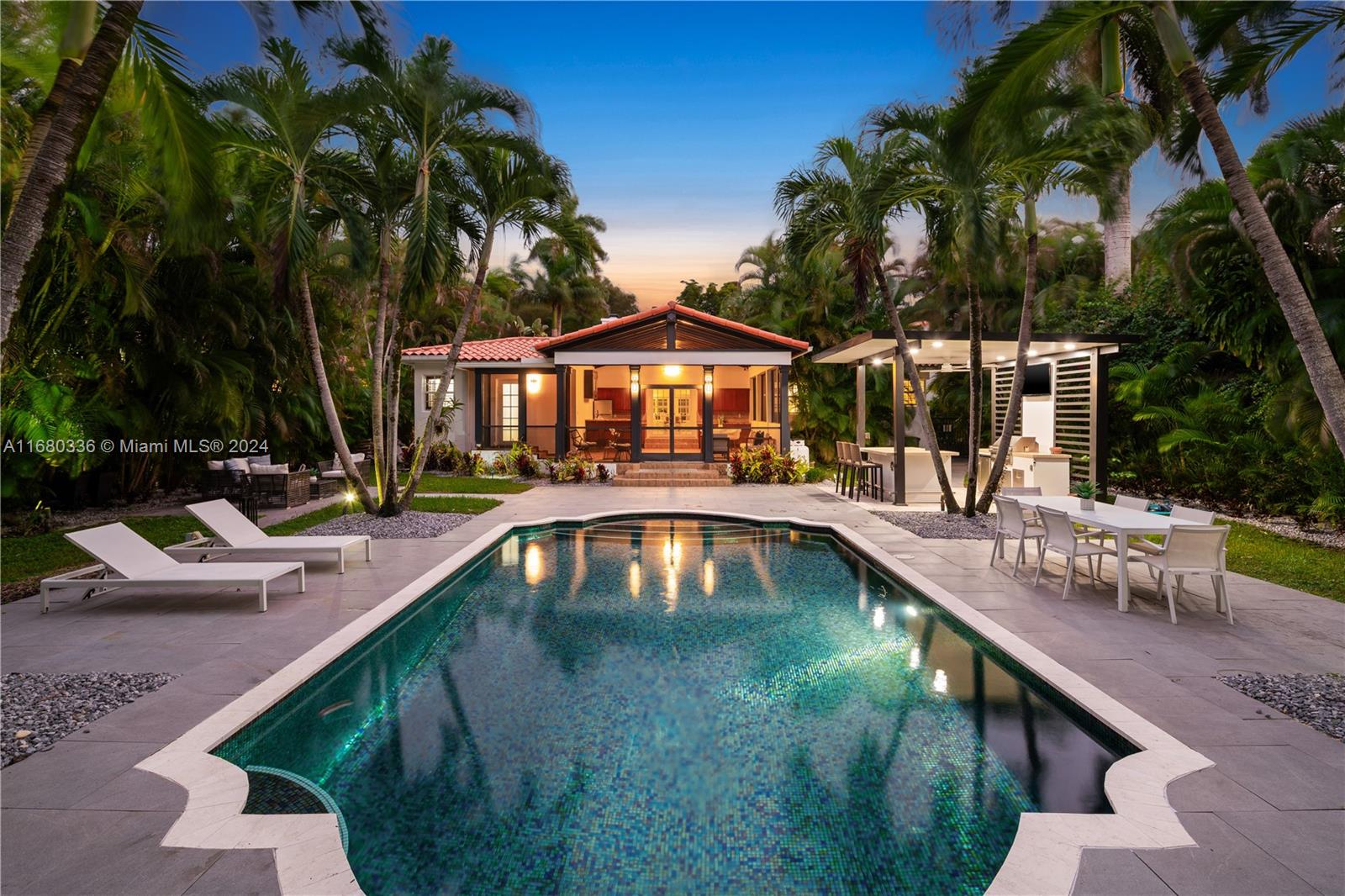 a swimming pool with outdoor seating and yard