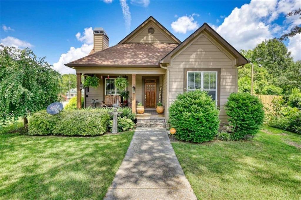 a front view of a house with garden