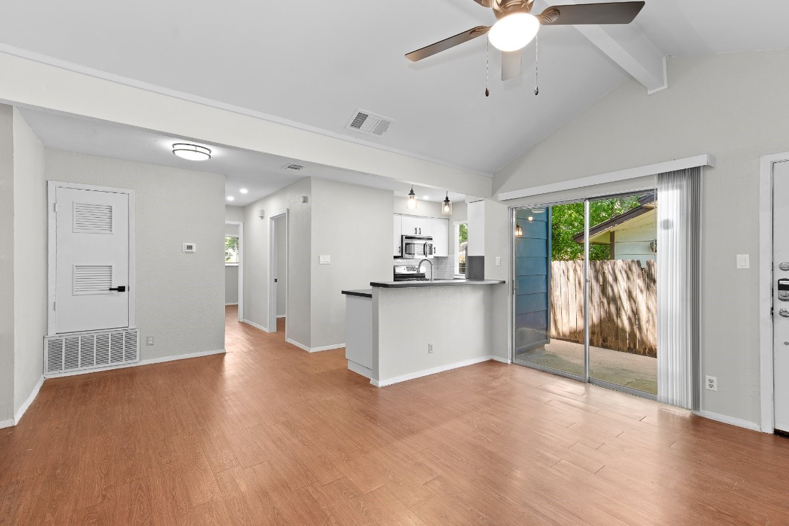 a view of a kitchen with a sink and a window