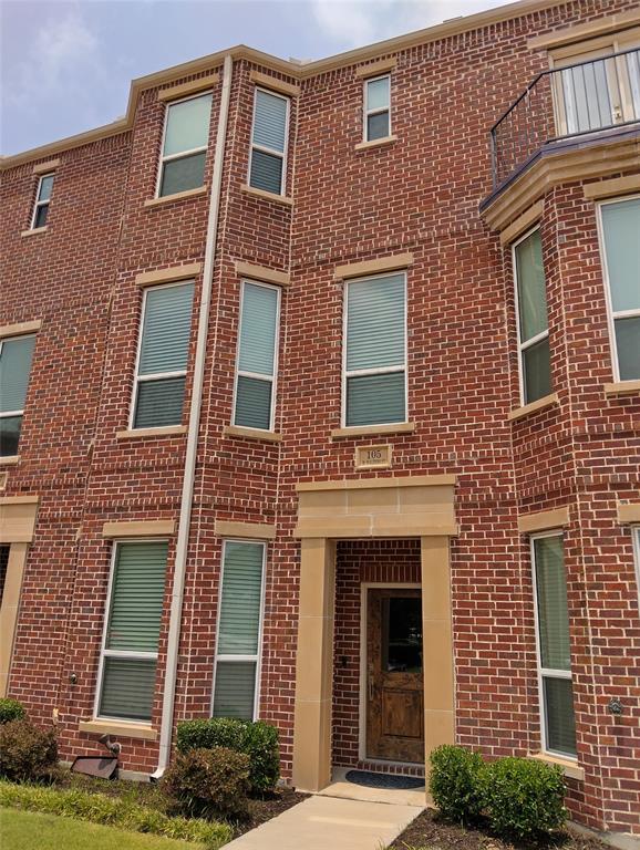 a front view of a brick house with windows