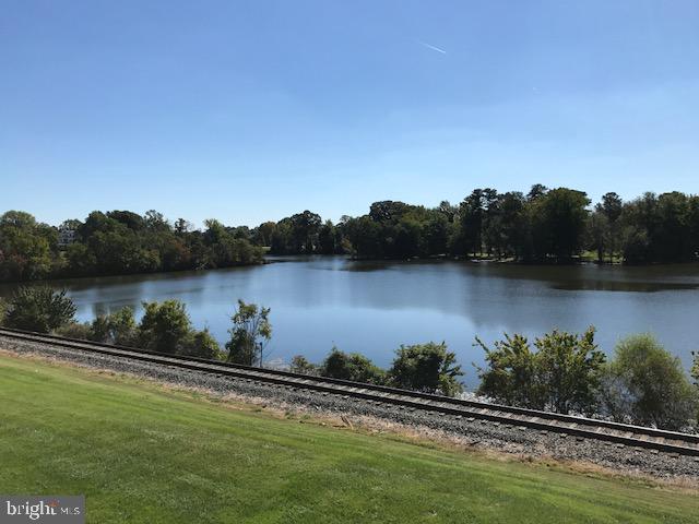 a view of a lake with houses in the back