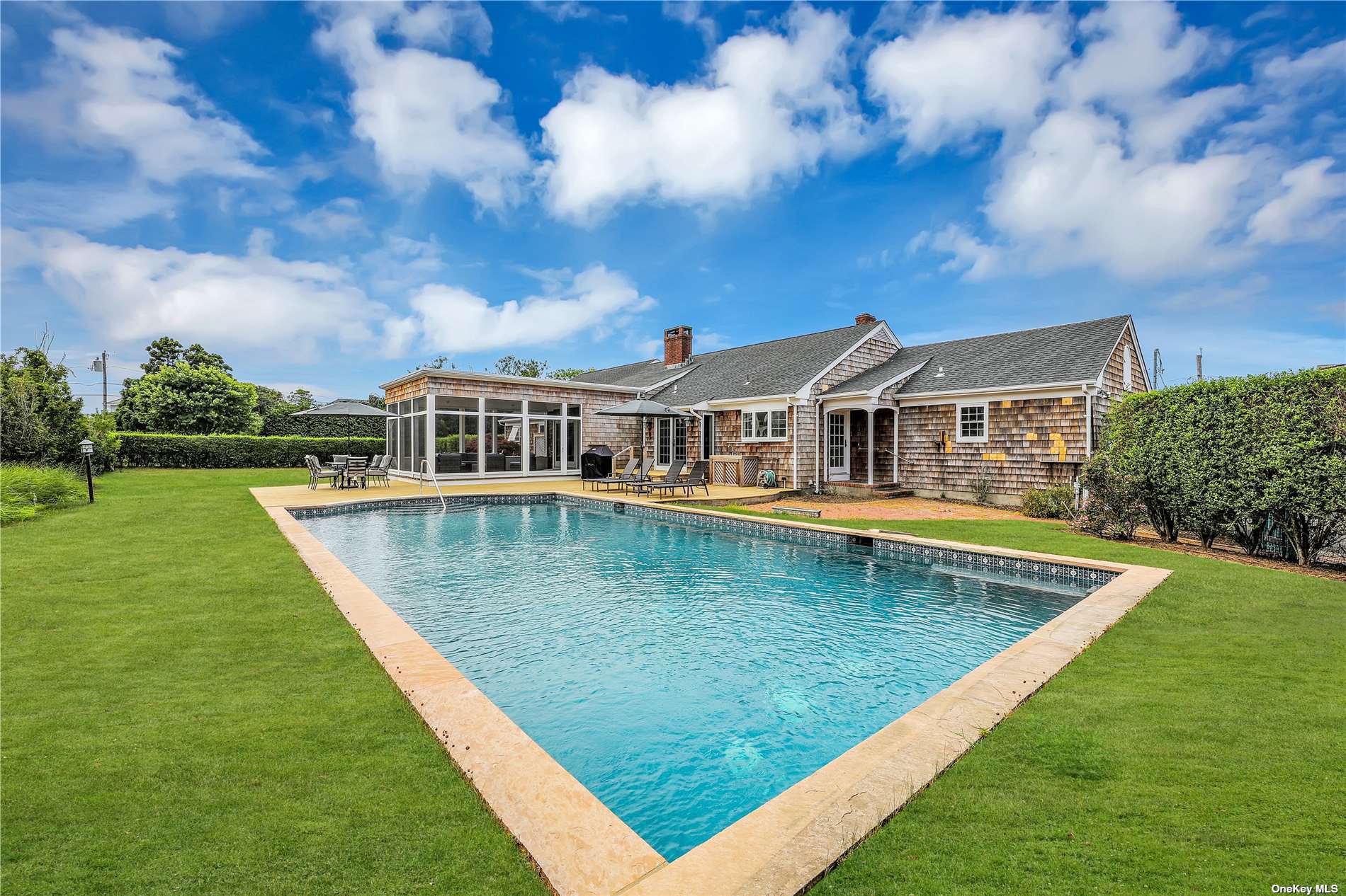 a view of a swimming pool with a yard