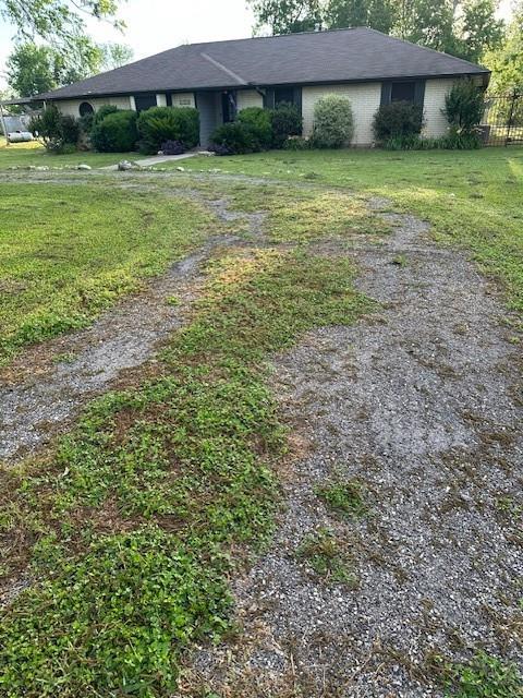 a view of a big yard with a house