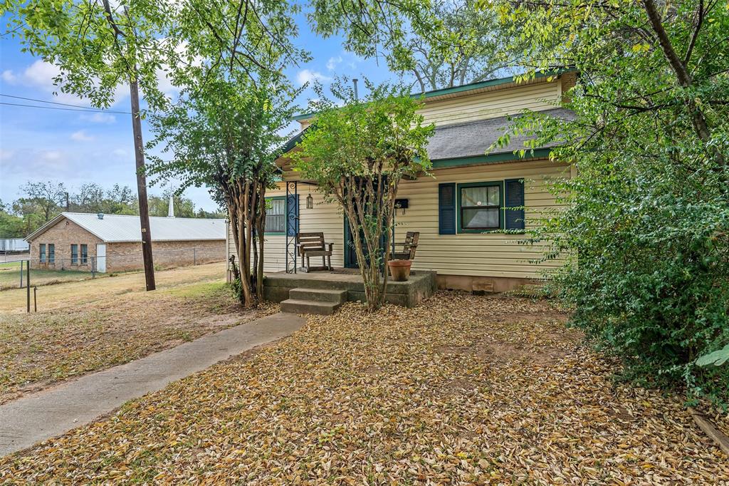 a house with trees in the background