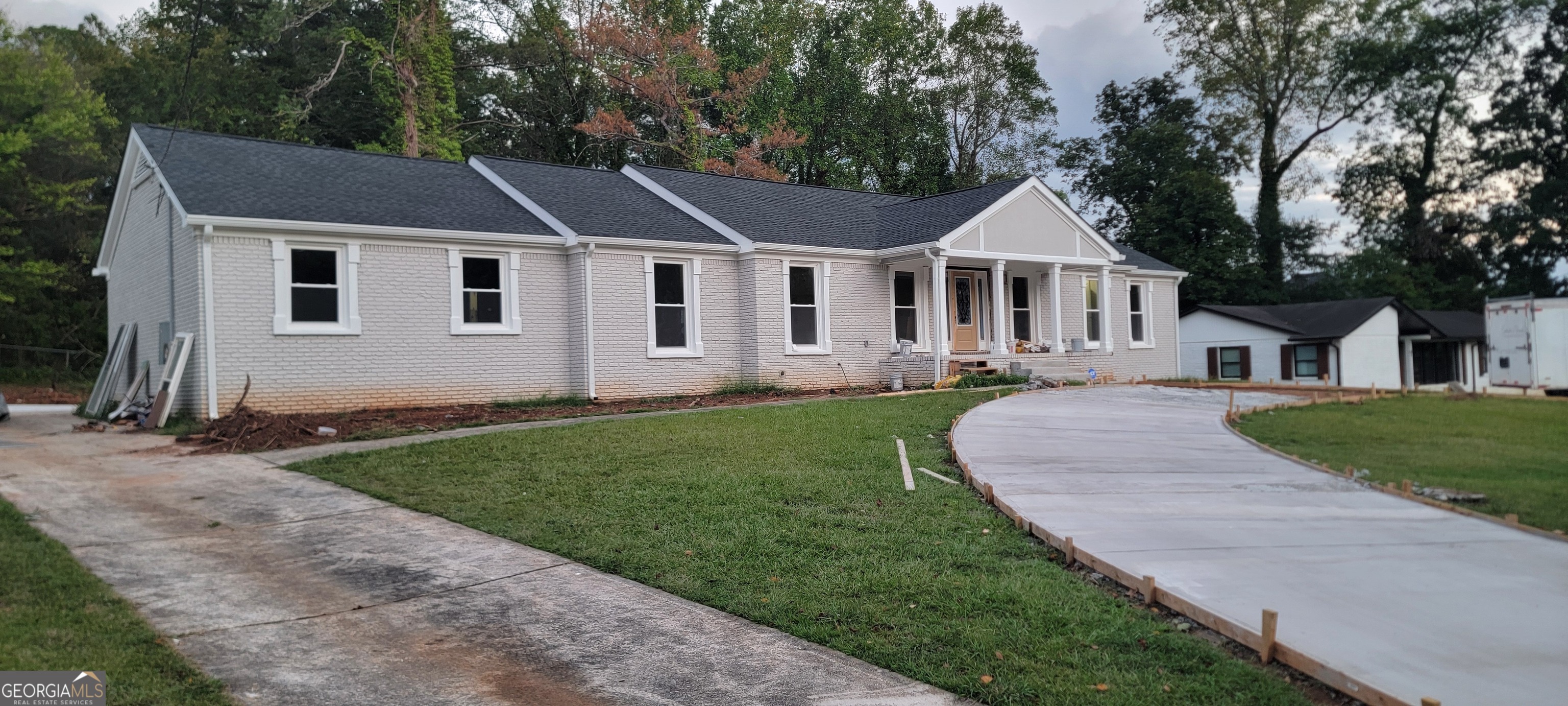 a front view of a house with a yard