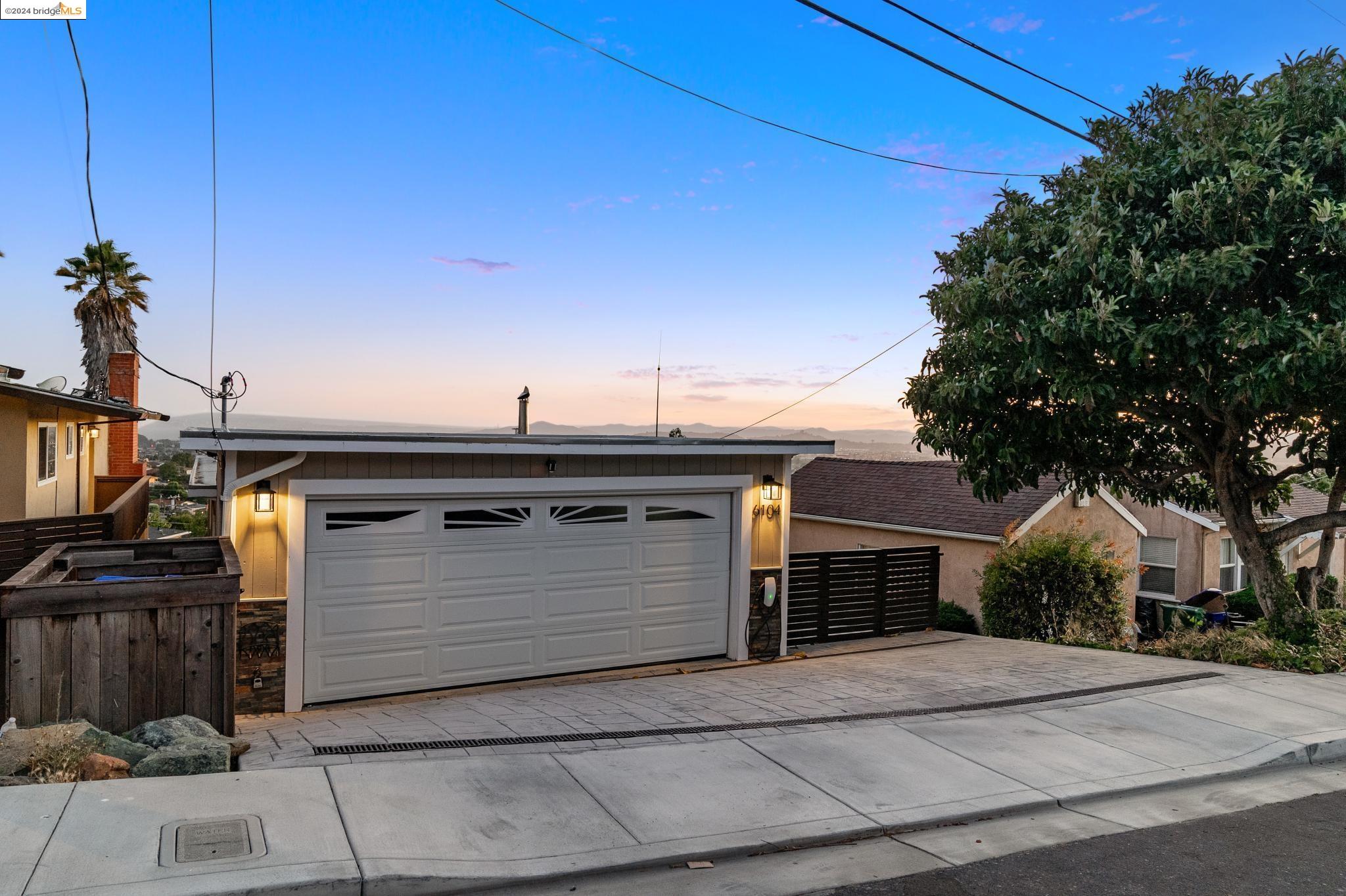 a front view of a house with a garage