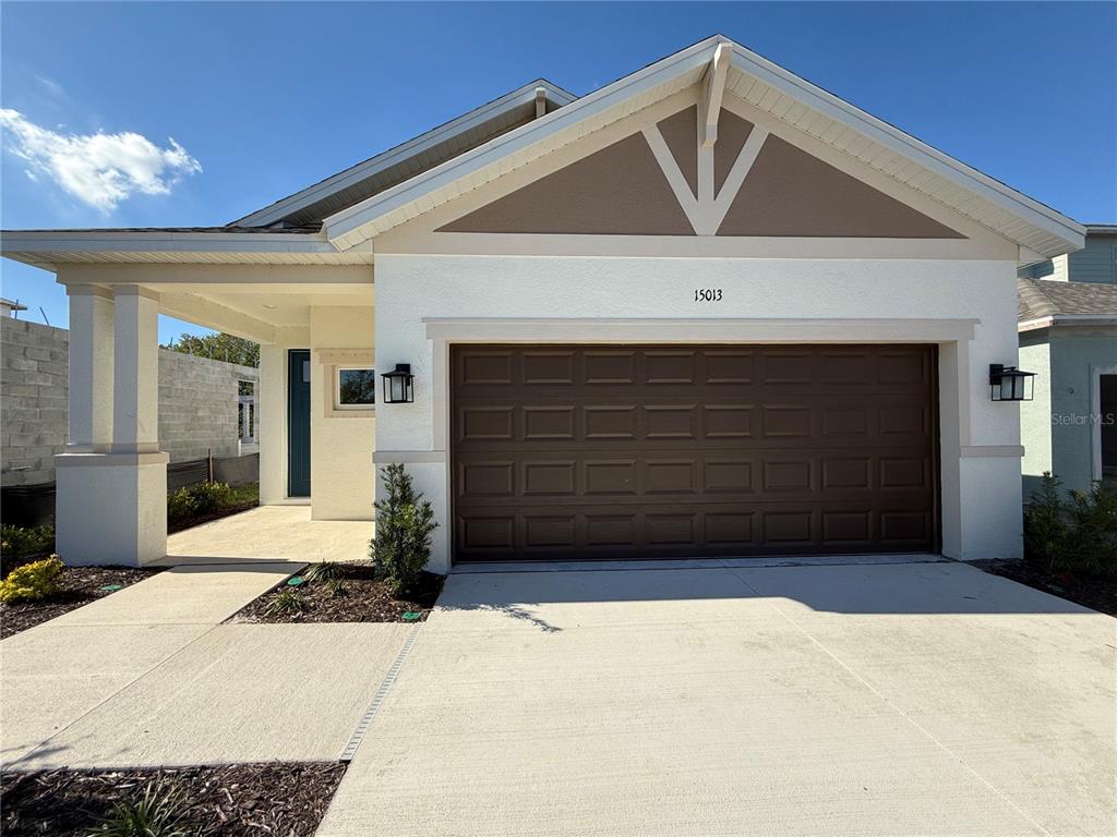 a front view of a house with garage