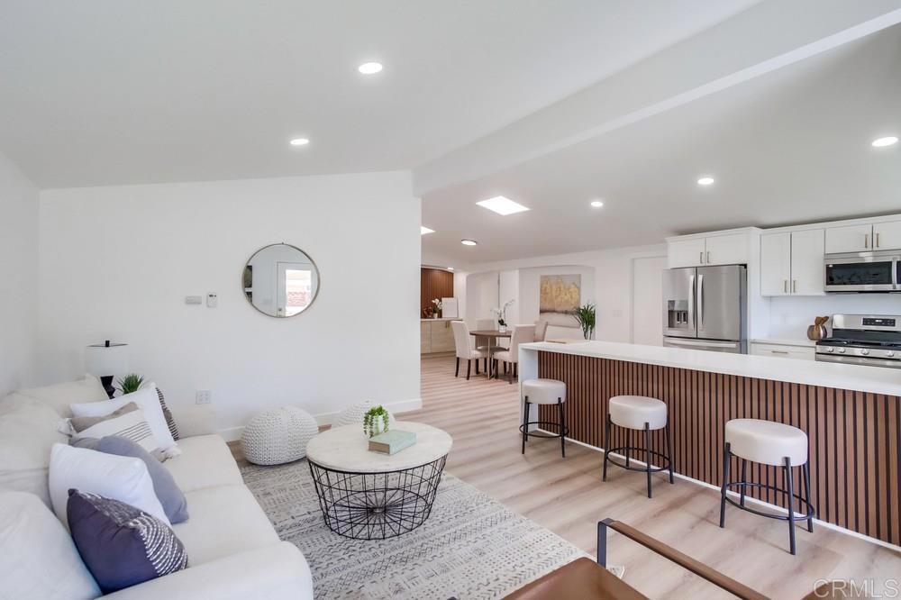 a living room with kitchen furniture and kitchen view