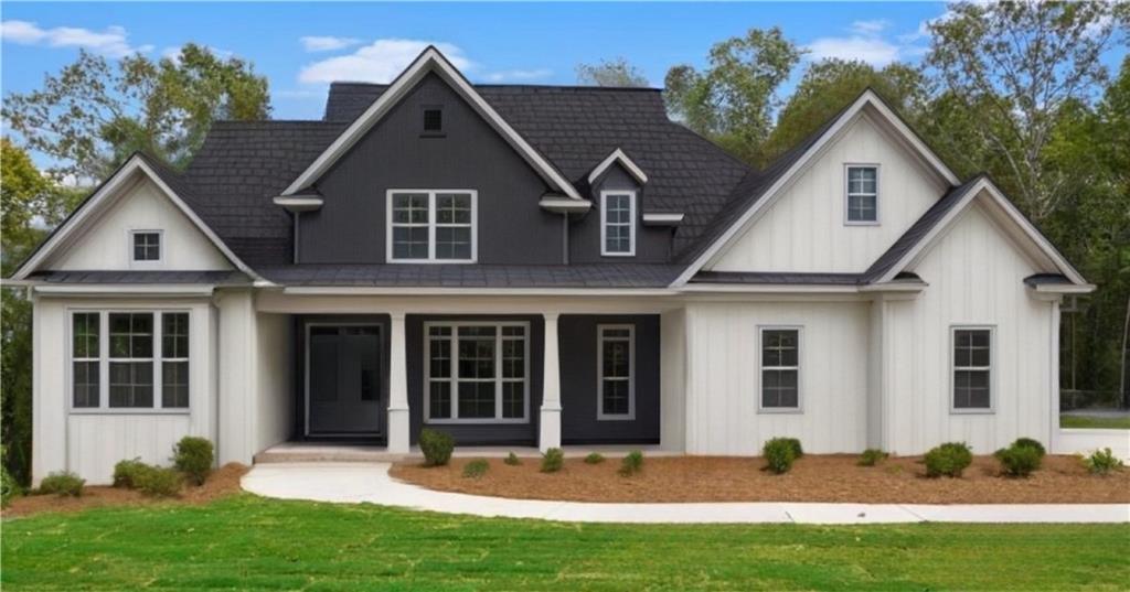 a front view of a house with a yard