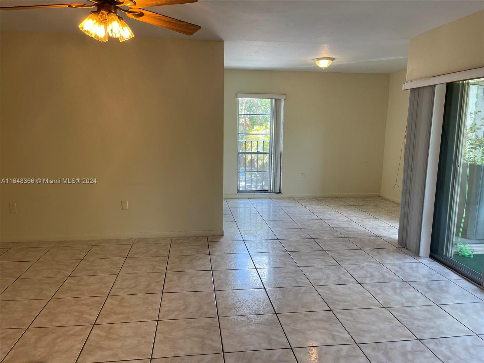 a view of an empty room and window in a room